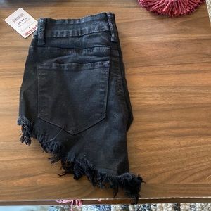 Brand new with tags Black Kancan distressed shorts size 24